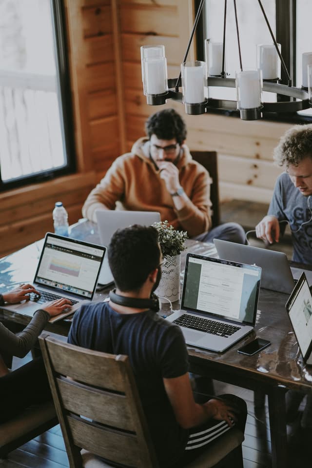 Technology team collaborating around a table